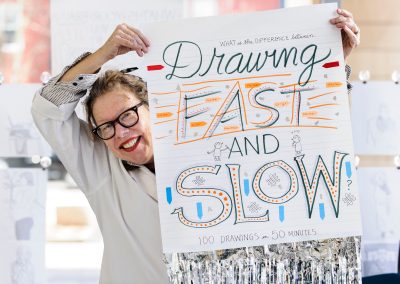 Art faculty Lynda Barry holds up assignment instructions for a student exercise in her Making Comics class at the Mosse Humanities Building at the University of Wisconsin-Madison.