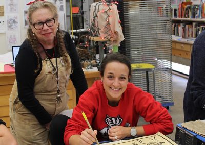 Art faculty Lynda Barry poses with a student in her Making Comics class at the Mosse Humanities Building at the University of Wisconsin-Madison.