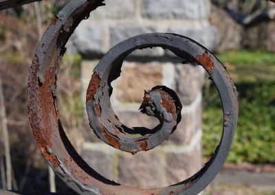 Garden Gate by Karen Singer. Photography of metal exposed to the elements makes for a lovely mix of rust, paint, and patina patterns. This piece of gate, along with a stone fence, follows the water way separating Connecticut from Rhode Island.