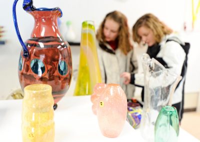 Patrons browse a selection of glass artwork offered for sale to the public during the annual UW Mad Gaffers Holiday Glass Sale at the glass lab at the University of Wisconsin-Madison.