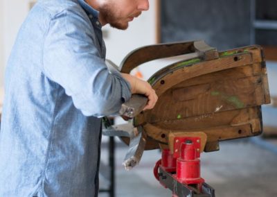 A student constructs a sculpture project.