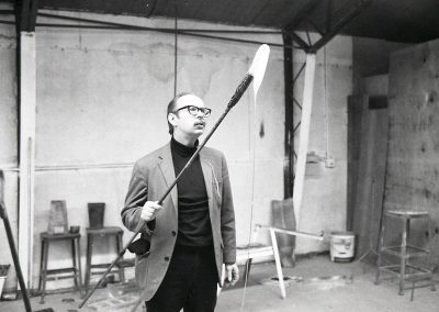 Professor of glass Harvey Littleton demonstrates glassblowing in the hot glass studio. During the 1963 academic year, Littleton introduced the first university program for glass in the United States at the University of Wisconsin-Madison.