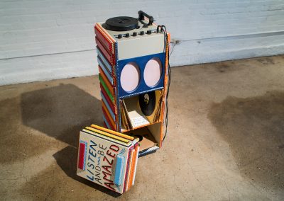 A tramp art whittle record player and cabinet art from Taylor Wright Rushing's Master of Fine Arts exhibition Slumgullion at the Arts + Literature Laboratory. Photography by Kyle Herrera.