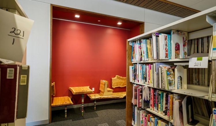 UW-Madison art professor Tom Loeser created seats and a table from an ash tree for the new Pinney Library. Photo by Andy Manis