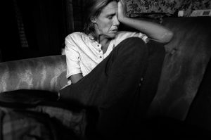 Julie cries after her father dies on Easter Sunday. From the series Family Love by Darcy Padilla. Valdez, Alaska 2007.