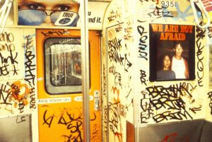 Photo of We Are Not Afraid art on the subway train by Les Levine