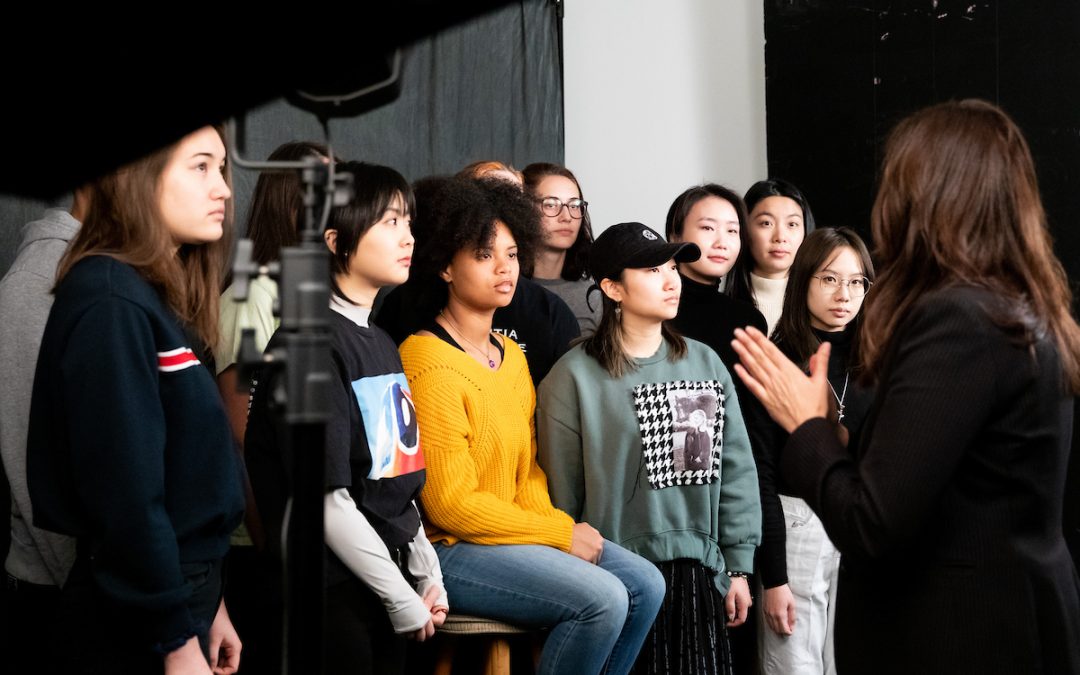 Darcy Padilla, assistant professor in the School of Education’s Art Department, demonstrates to her intermediate photography class how to move and adjust studio lights. At the start of 2020, classes proceeded as normal. February 2020. Photo by Sarah Maughan.